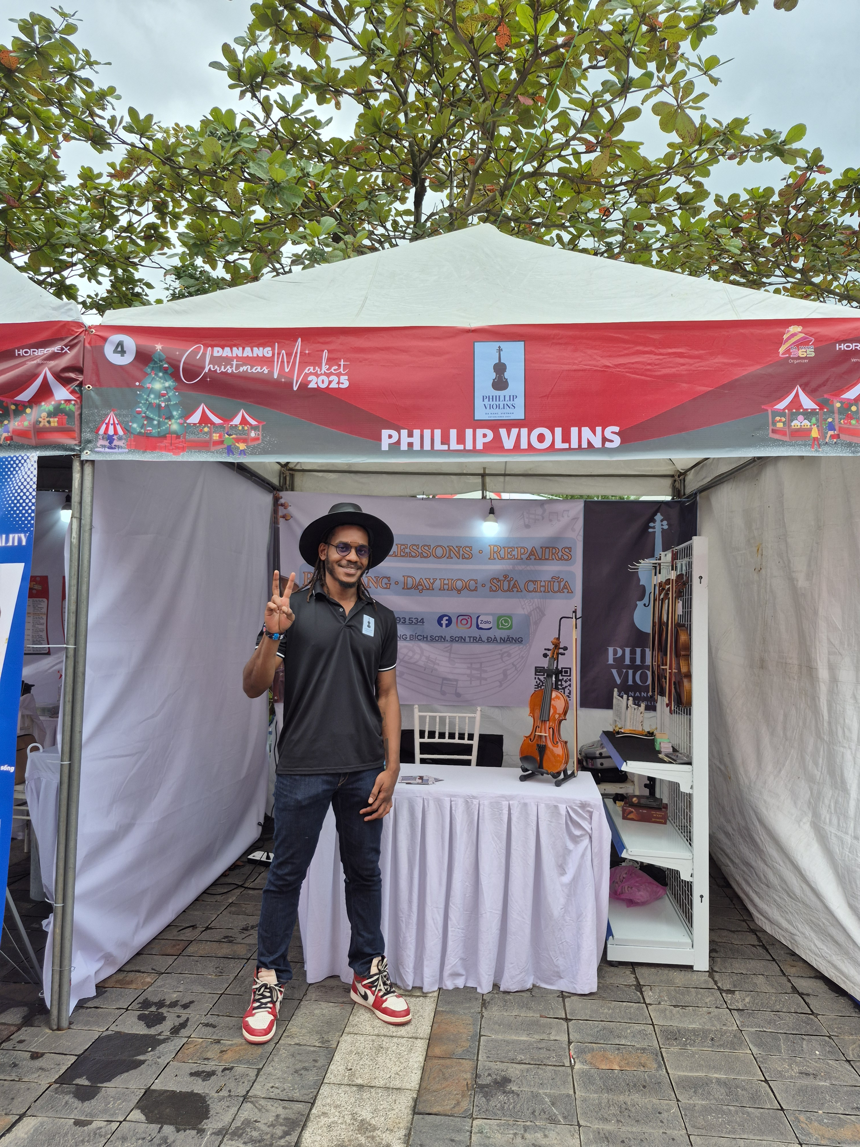 Rahmaan Phillip at the Phillip Violins booth in Da Nang, Vietnam.