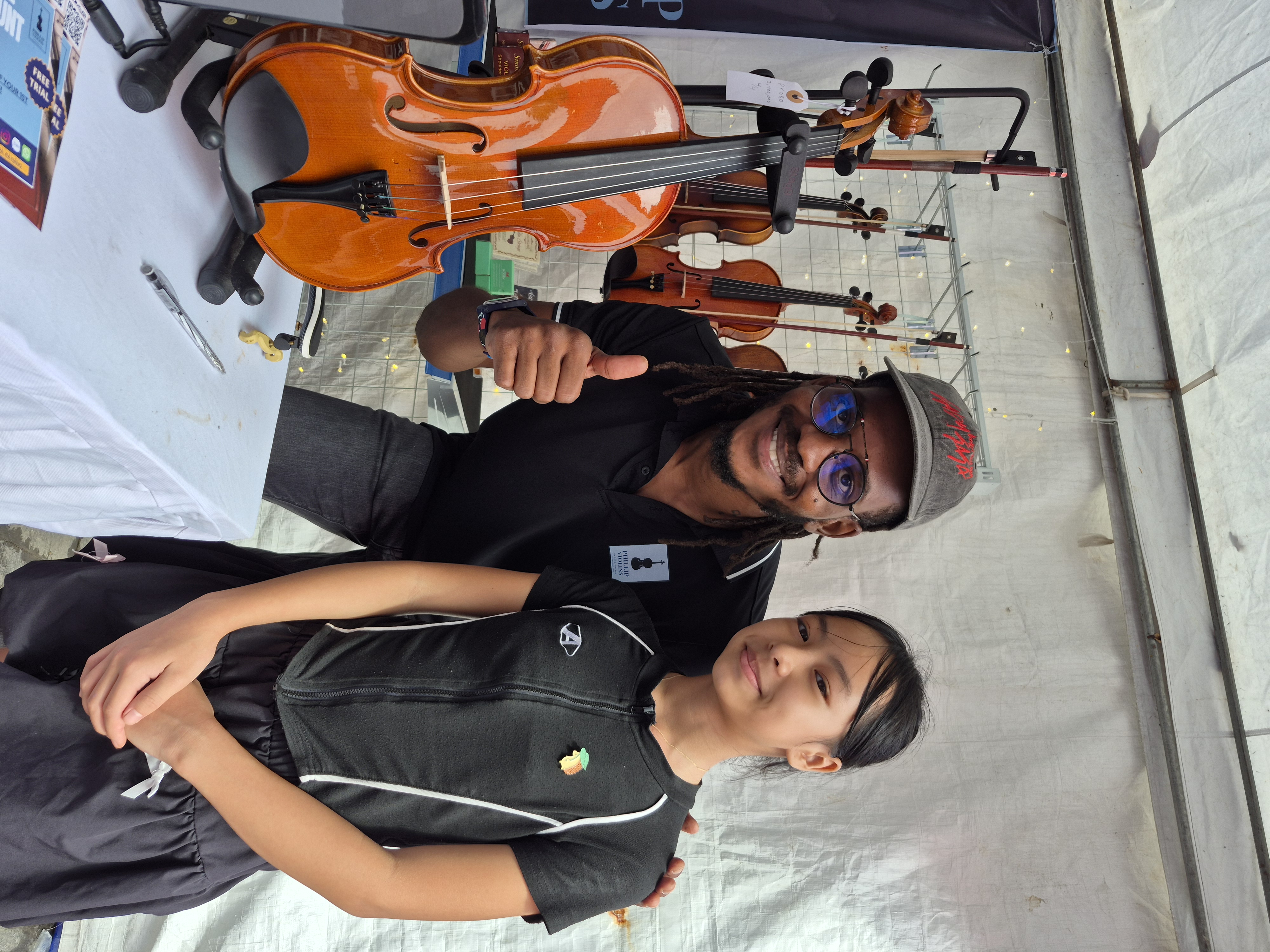 Rahmaan with a student at Phillip Violins, Da Nang